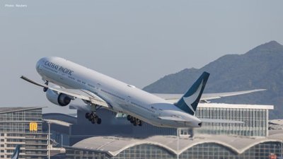 Cathay Passenger Arrested After Attempt to Open Plane Door During Flight